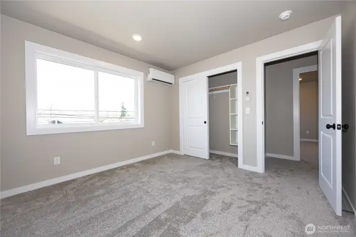 Closet in bedroom #2 has quality built-in shelves