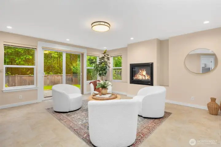 Lower level living room features cozy radiant floors and a gas fireplace.