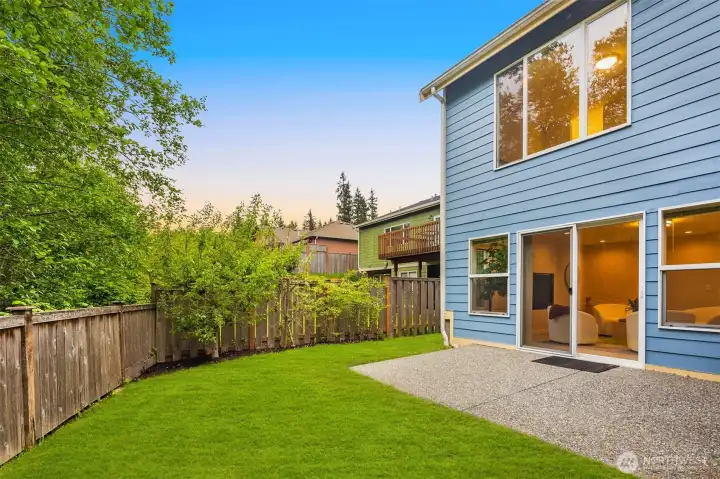 The backyard has plenty of space, and low maintenance landscaping.