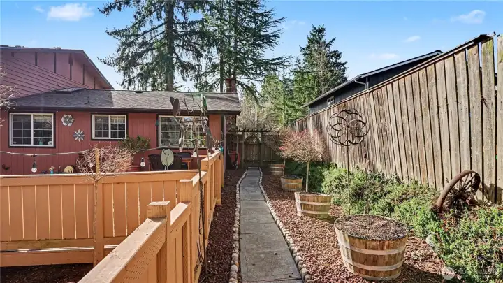 Charming walk way leads to the front yard.