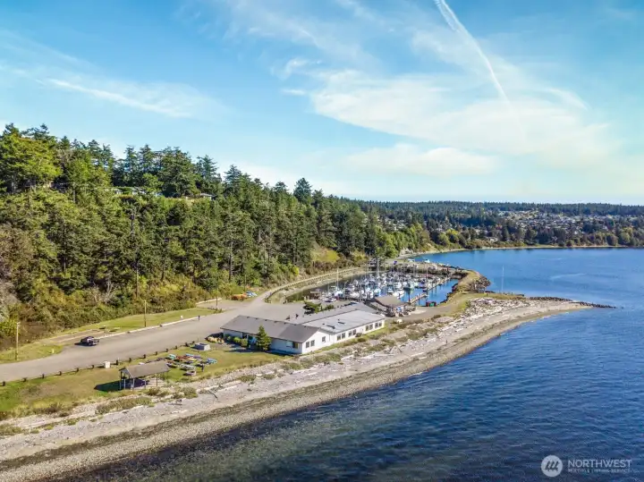 Aerial view of the beach, marina & clubhouse aras