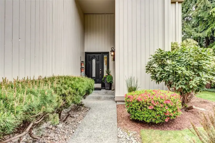 Beautiful entry way with professional landscaping