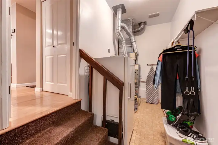 Stairs from the kitchen leading into the laundry room