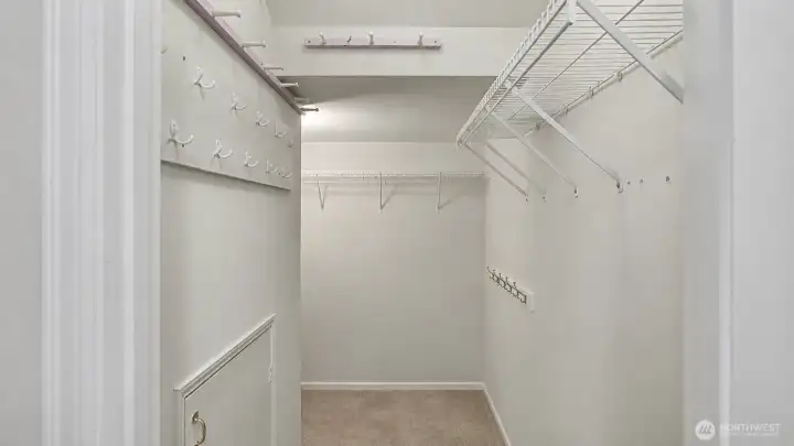 Lighted closet w/ ample storage - Virtually removed hangers & coats Lighted closet w/ ample storage - Virtually removed hangers & coats