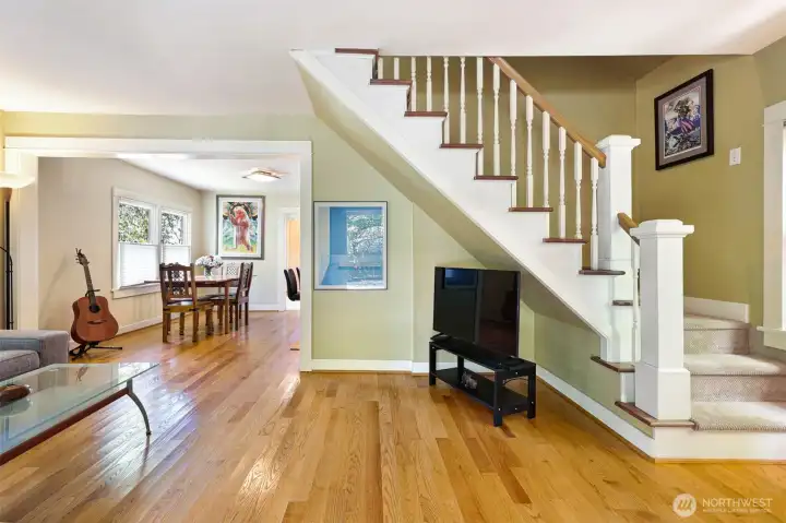 Main floor shot from the front door. Beautiful oak floors and a wonderful open concept living space. Just out of the picture to the right is a convenient coat closet.