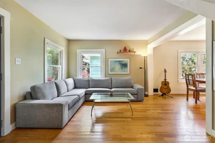 Living room and adjoining dining room to the right.