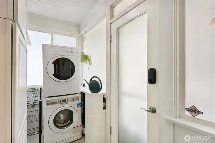 Laundry room conveniently located just off the kitchen.