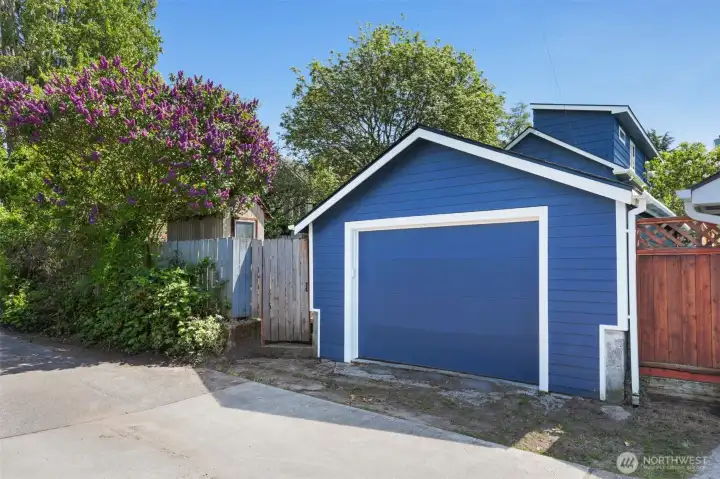 Garage off the paved alley. Newer garage door and garage door opener.