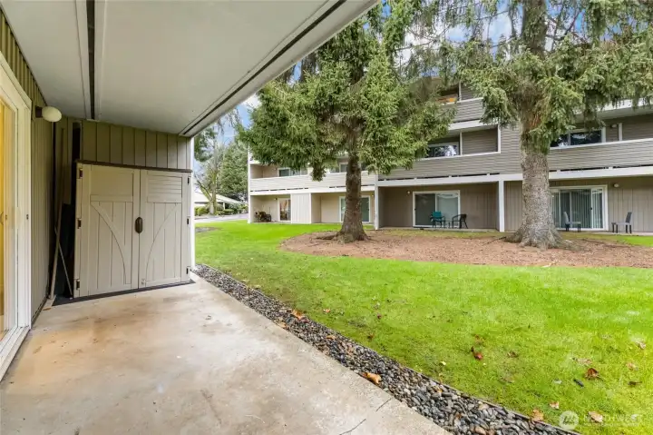 Spacious private end-unit covered patio perfect for morning coffee, relaxing outdoors, & additional storage