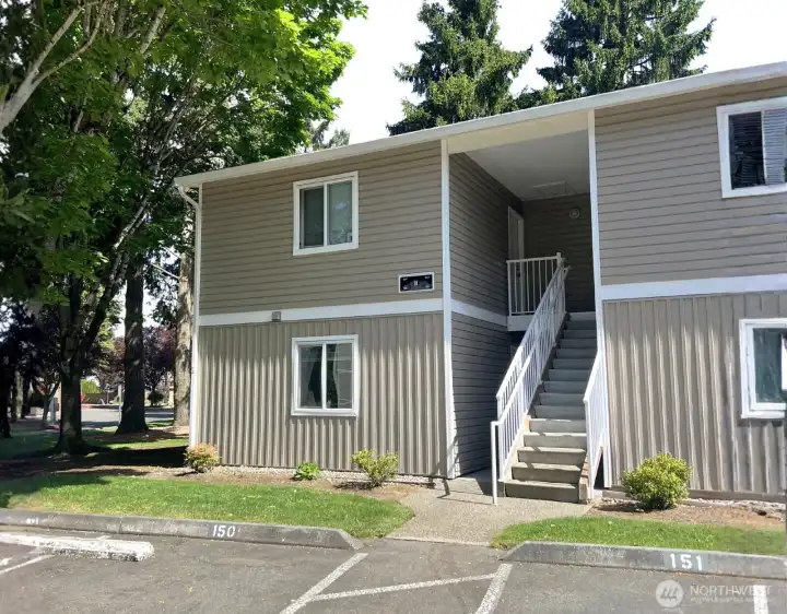 Assigned unit parking spot steps from the front door, community EV charging, and guest parking lot conveniently located directly across from the condo.