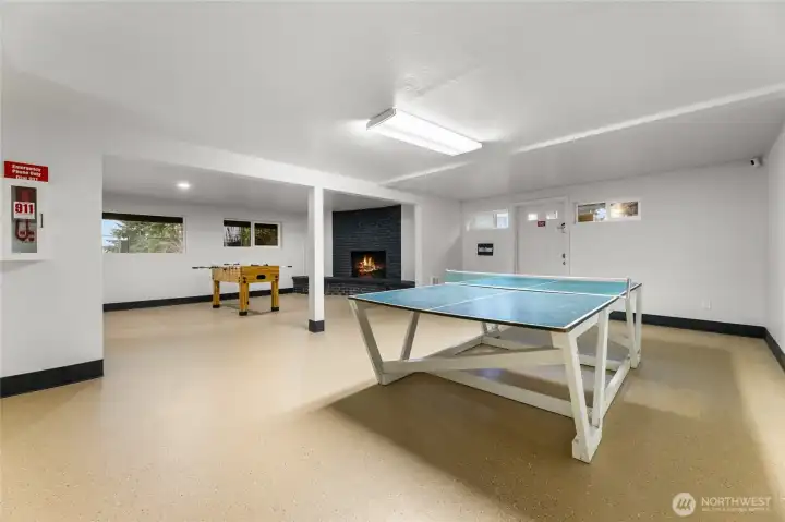 Gathering space featuring a ping-pong table & foosball, perfect for a game night!
