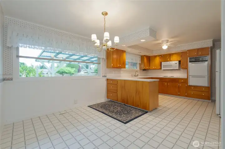 Kitchen and dining looking out to the rear yard and gardens