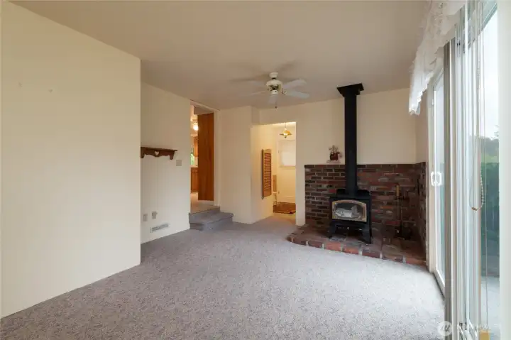Family room off kitchen with wood burning stove