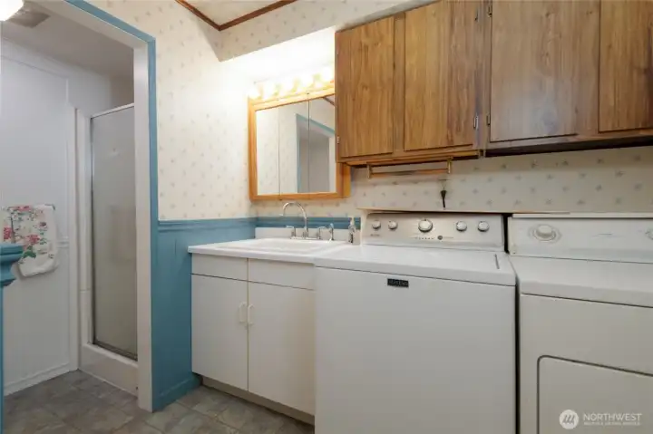 Utility and 3/4 bath off family room