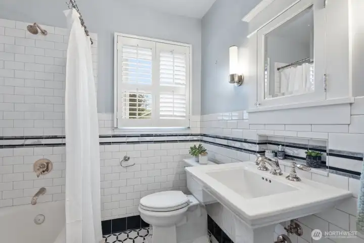 Stylish tilework makes this main floor full bathroom shine.