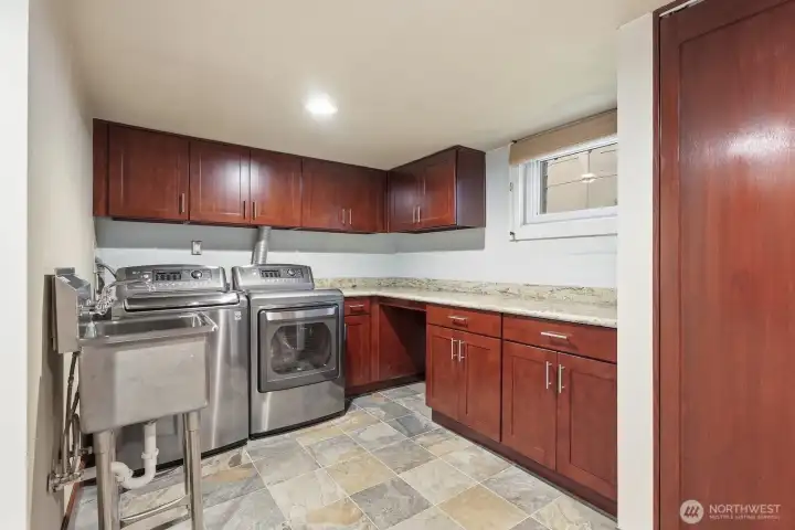 Oversized laundry room with tons of storage.