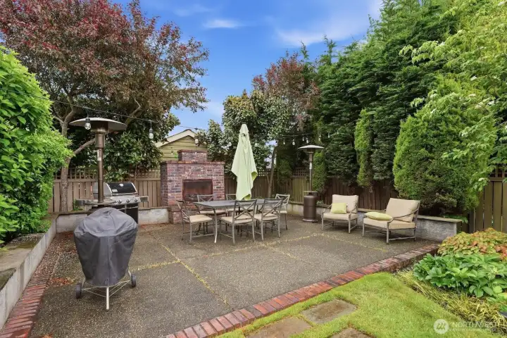 Outside, your private backyard oasis awaits! This sun-soaked patio with a built-in fireplace is bound to be your favorite place to spend time for many summers to come.
