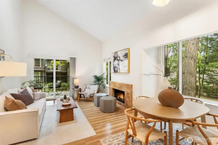 Living and dining areas showcasing soaring ceilings and expansive windows. Living and dining areas showcasing soaring ceilings and expansive windows.