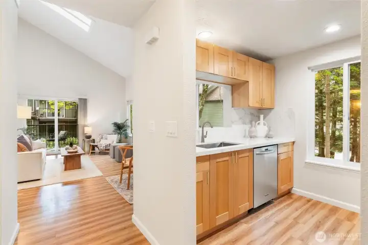 Remodeled kitchen with quartz countertops, stainless steel appliances, and abundant cabinetry. Remodeled kitchen with quartz countertops, stainless steel appliances, and abundant cabinetry.