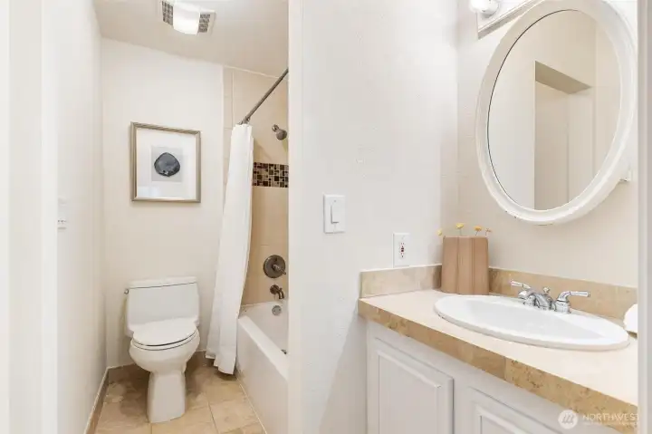 Additional full bathroom with oversized vanity and tub/shower combination. Additional full bathroom with oversized vanity and tub/shower combination.