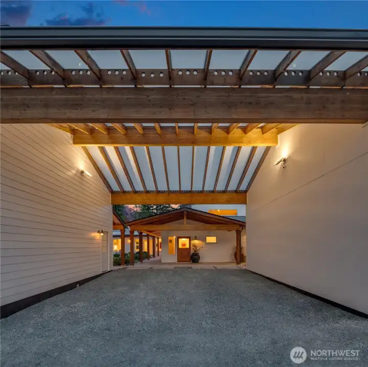 Extra covered parking between the studio space and the detached 2 car garage.