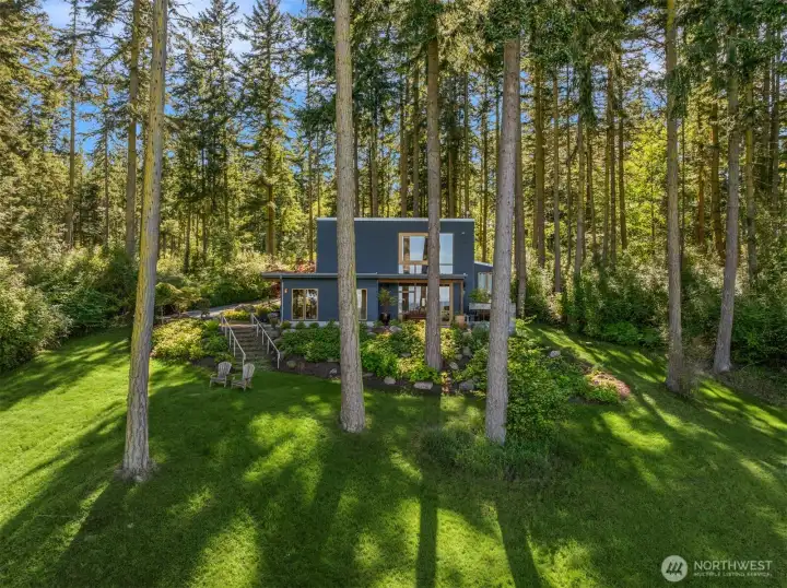 The Dwell House is perched atop the hillside, capturing breathtaking Mount Baker and water views stretching across Saratoga Passage toward Camano Island.