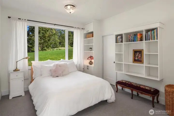 The bedrooms feature custom built-in walls of closets and drawers, thoughtfully designed to provide exceptional organization and storage.
