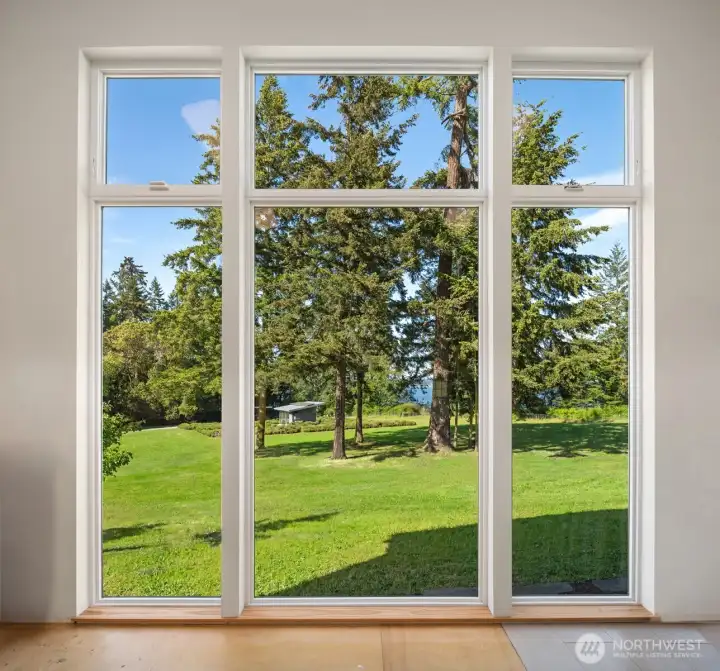 Floor-to-ceiling windows capture stunning water views and the peaceful sight of baby deer wandering by while you work remotely.