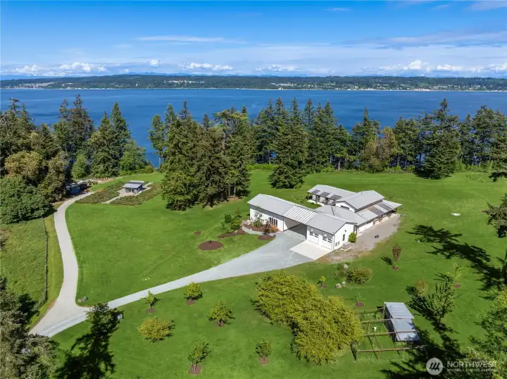 It’s the full package — luxury living, exceptional privacy, sprawling acreage, orchards, and two stunning homes, plus an additional parcel to sell, develop, or preserve for generations to come. A truly rare waterfront offering unlike anything else on the market.