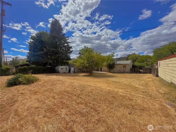 Backyard towards home and outbuilding Backyard towards home and outbuilding