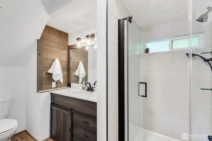 Main floor bathroom has radiant heated floors.