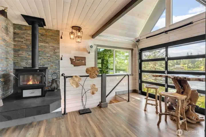 Relax warmly on chilly evenings around the wood burning fireplace with stone veneer surround.