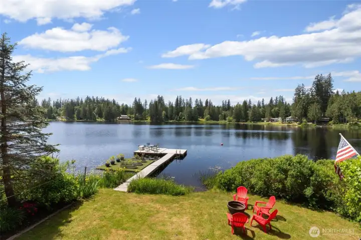 Flat grassy area leads to your own private dock.