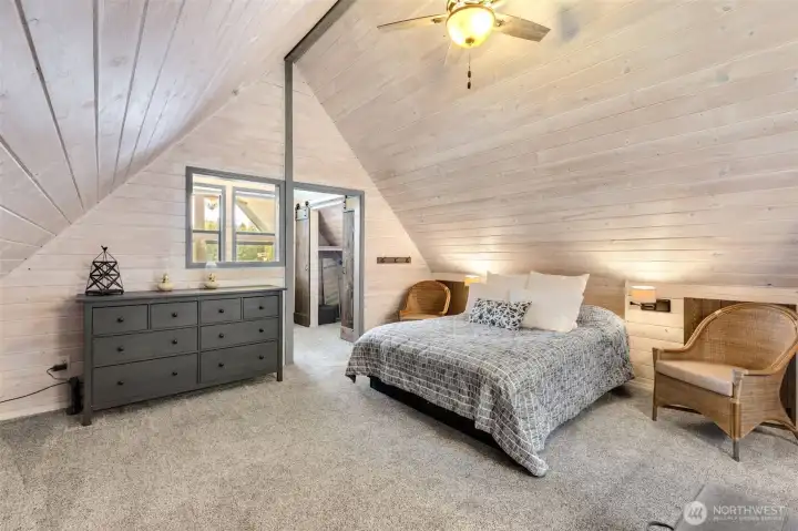 Upstairs owner's suite with vaulted ceiling and four lower wall storage areas.