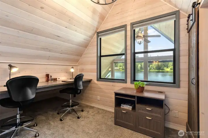 Office or bonus room adjacent to the bedroom. Sliding wood door leads to walk-in closet.