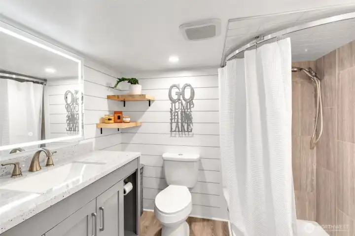 Lower bathroom with shower, and heated LVP floors.
