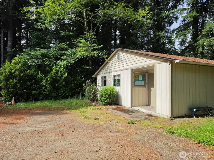 Clubhouse is located on the northern side of the property. To the right of the orange cone is the lot.