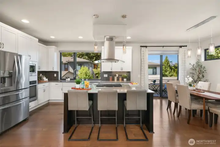 The kitchen, with a large central island is a focal point of the home and immediately grabs attention. The kitchen, with a large central island is a focal point of the home and immediately grabs attention.