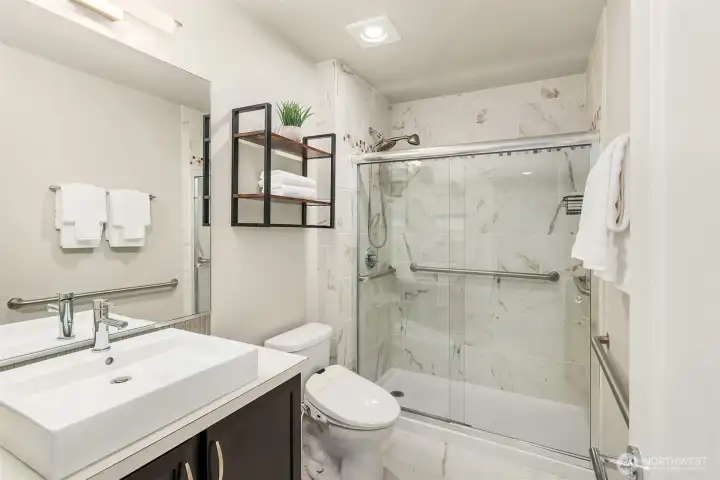 Upgraded three quarter bath on the lower level - attached to the lower level bedroom, making for a very private, and luxurious guest suite. Great for multi-generational living or extended guests Upgraded three quarter bath on the lower level - attached to the lower level bedroom, making for a very private, and luxurious guest suite. Great for multi-generational living or extended guests