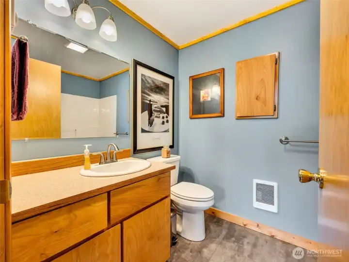 Guest bathroom is complete with a bathtub. Guest bathroom is complete with a bathtub.