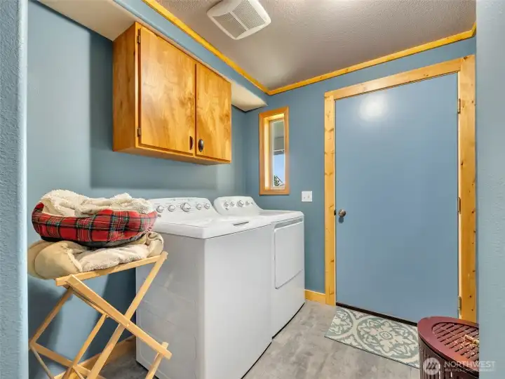 Large utility room leads out to the garage. Large utility room leads out to the garage.