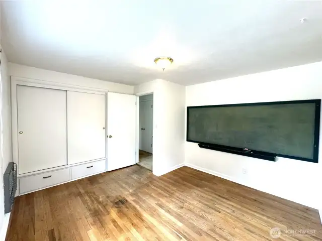 Mainfloor bed, seller says these hardwoods are in living room as well.