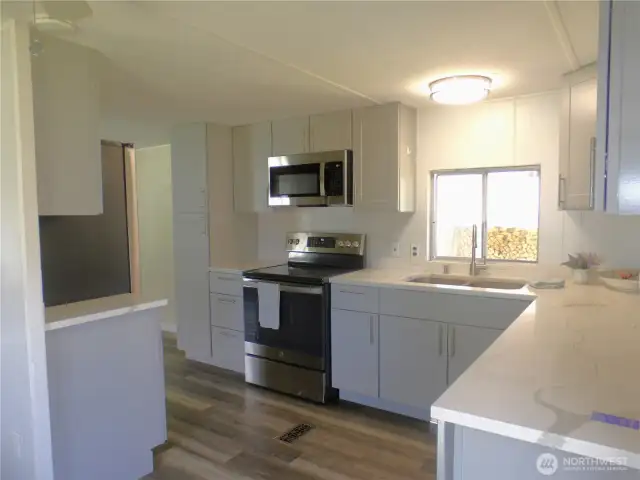 Quartz, stainless steele appliances, new floors and cabinets.