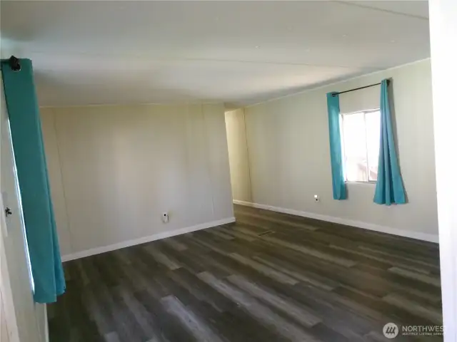 This is the living room at the entry. Next photos take you down the hall.