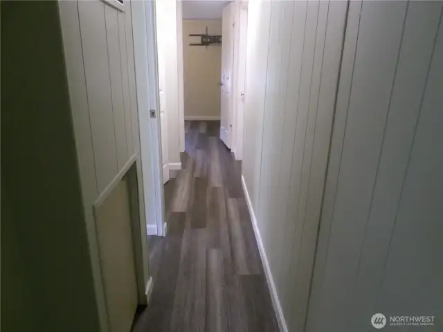 Hall leads to small bedroom, bathroom, main bedroom and laundry room.