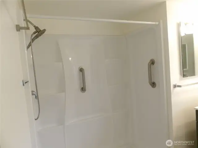 Shower has safety grab bars.