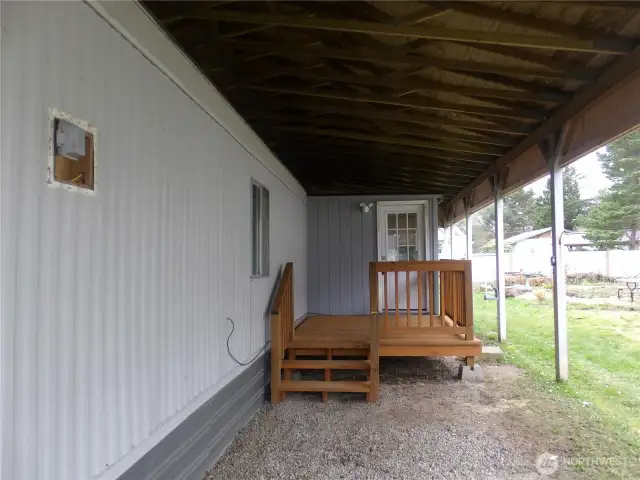 Car port area.  New porch with room for a small table.