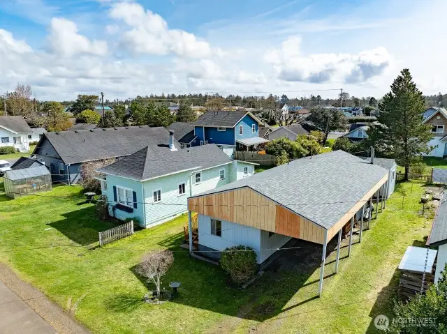 Looking Southeast.  You can see buildings of Ocean Park, WA in this drone shot.  Drive to the store in a minute, or walk if you wish.