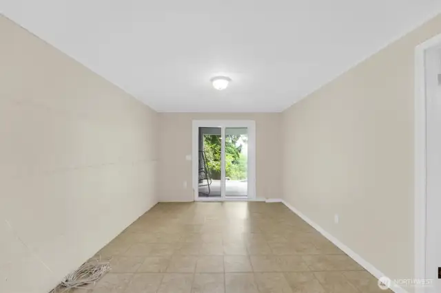 Downstairs flex space with sliding glass doors