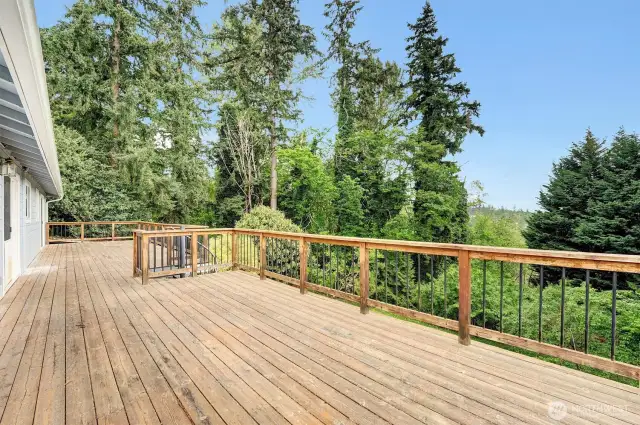Huge Deck and this home features 4 Sliders to the patio areas.